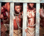 A scene from Roots: slaves in a cage