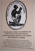 A photo of the Wedgwood supplicant slave on a museum information panel