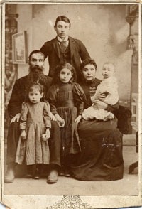 Jewish immigrant family posing for a photographer