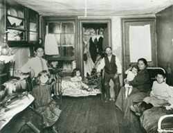 Italian or Sicilian immigrant family in their apartment.