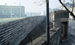 A photograph of the Berlin Wall and Death Strip seen from the Bernauerstrasse viewing platform in the French sector.