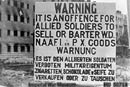 A photograph of a British notice in Berlin warning soldiers and civilians of the penalties of fraternisation, 1945/6.